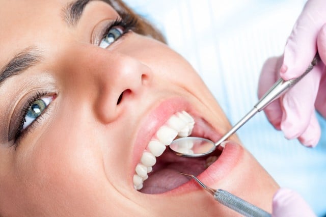Dentist working on girls teeth 000045380798 Small 1 1 e1477497076838